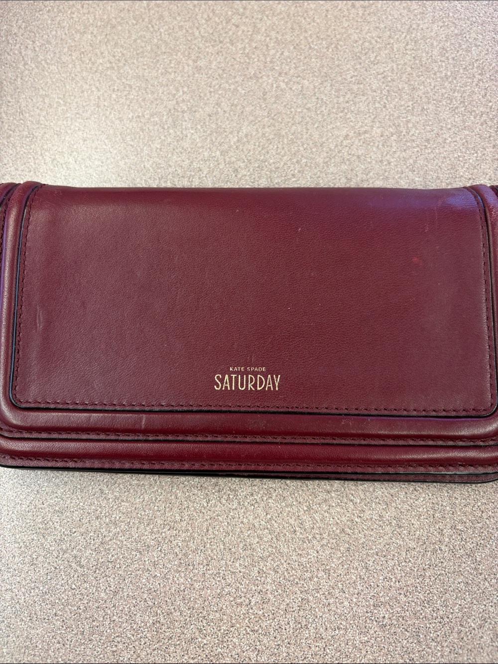 Kate Spade Saturday Burgundy Leather Wallet Clutch GUC approx 7.5x5x.7